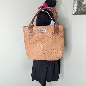 Tan textured ostrich purse by Braciano
